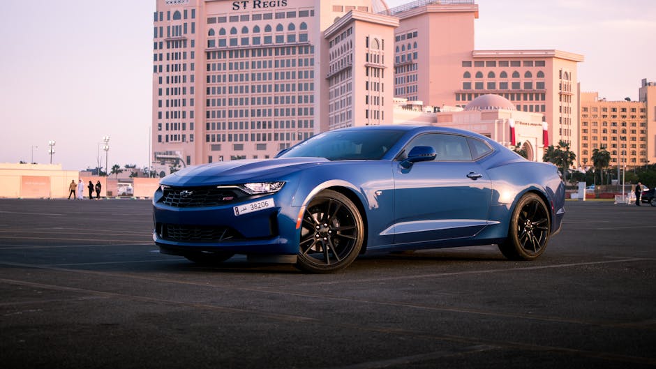 Blue Chevrolet Camaro at sunset