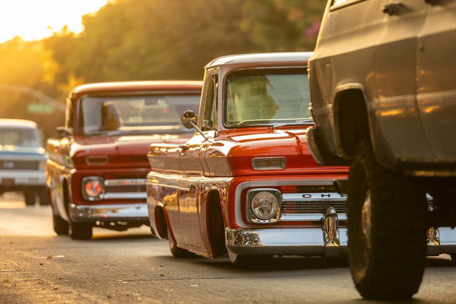 Classic Chevy C10 trucks at golden hour